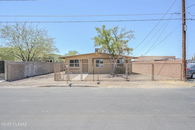 18 E Mac Iver Pl, Tucson, AZ 85705 - view of front of home with stucco siding and a fenced front yard