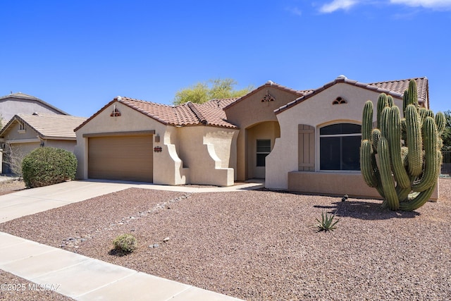 9438 N Weather Hill Dr, Tucson, AZ 85743 - mediterranean / spanish-style home with stucco siding, a garage, concrete driveway, and a tiled roof