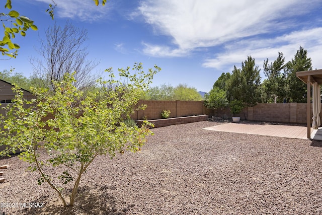 9438 N Weather Hill Dr, Tucson, AZ 85743 - fenced backyard featuring a patio area