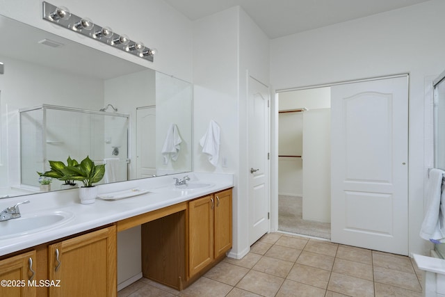 9438 N Weather Hill Dr, Tucson, AZ 85743 - bathroom with double vanity, a stall shower, and tile patterned floors