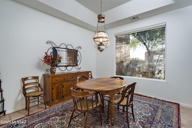 10380 E Rancho Del Este Dr, Tucson, AZ 85749 - tiled dining room featuring a chandelier and baseboards