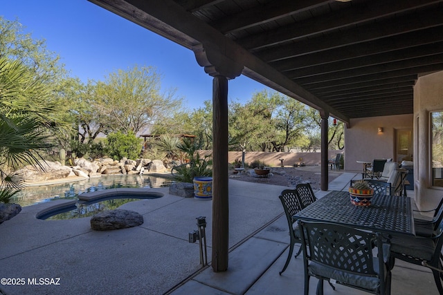 10380 E Rancho Del Este Dr, Tucson, AZ 85749 - fenced backyard featuring a patio, a jacuzzi, and outdoor dining space