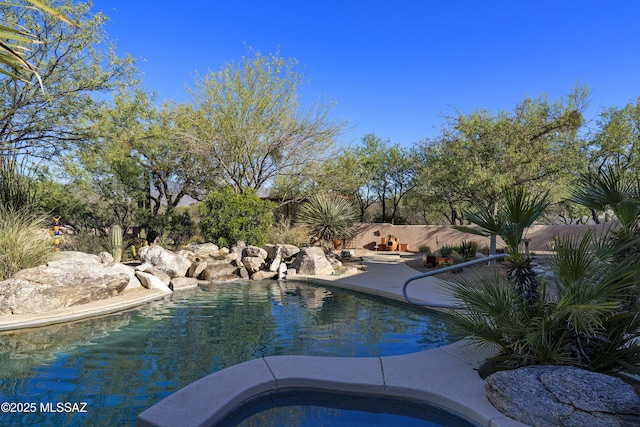 10380 E Rancho Del Este Dr, Tucson, AZ 85749 - swimming pool with an in-ground hot tub and a patio