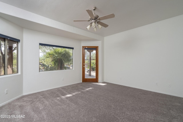 10380 E Rancho Del Este Dr, Tucson, AZ 85749 - spare room featuring carpet flooring, healthy amount of natural light, and a ceiling fan