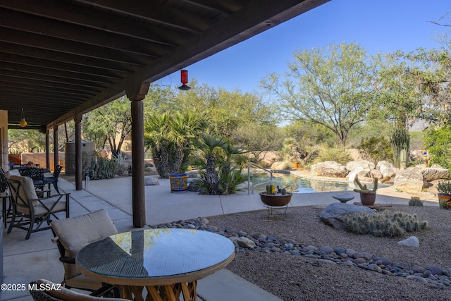 10380 E Rancho Del Este Dr, Tucson, AZ 85749 - view of patio with outdoor dining space and an outdoor pool