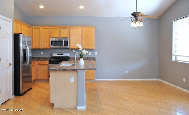 5553 W Carriage Dr, Tucson, AZ 85742 - kitchen with stainless steel appliances, light wood-style floors, ceiling fan, and recessed lighting