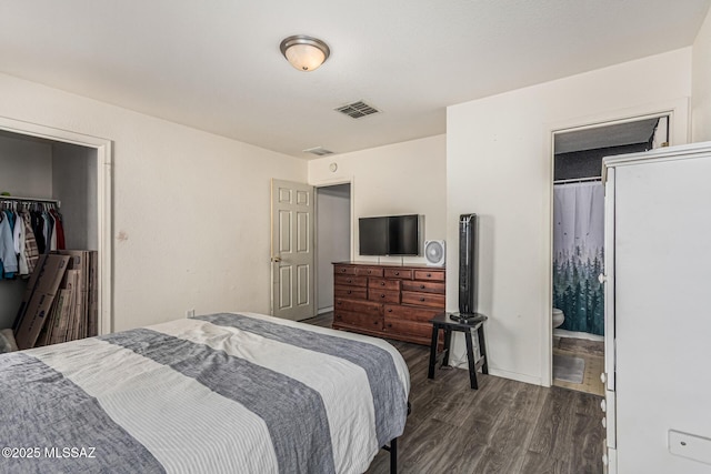 6293 S Sun View Way, Tucson, AZ 85706 - bedroom featuring dark wood-style floors, a closet, ensuite bathroom, and a spacious closet