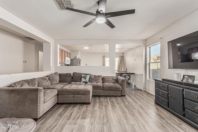 6293 S Sun View Way, Tucson, AZ 85706 - living area featuring ceiling fan and light wood-style flooring