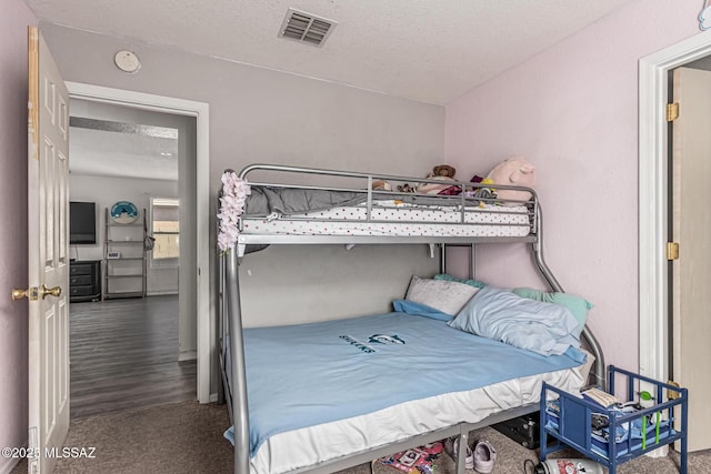 6293 S Sun View Way, Tucson, AZ 85706 - bedroom featuring a textured ceiling and carpet