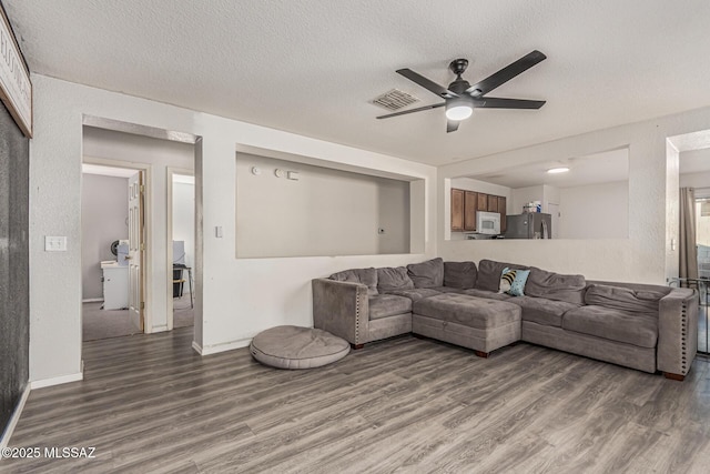 6293 S Sun View Way, Tucson, AZ 85706 - living area featuring wood finished floors, ceiling fan, and a textured ceiling