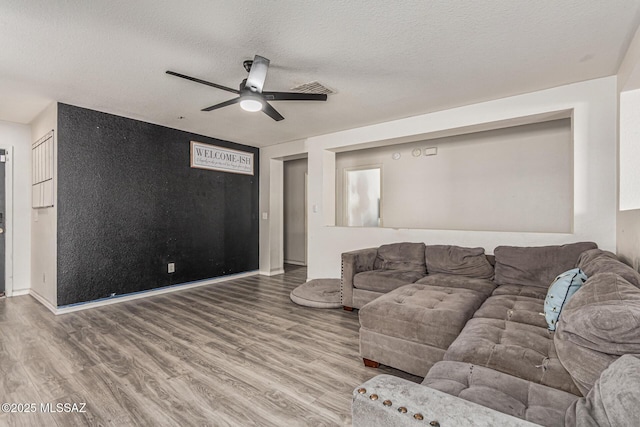 6293 S Sun View Way, Tucson, AZ 85706 - living area featuring a ceiling fan, wood finished floors, and a textured ceiling
