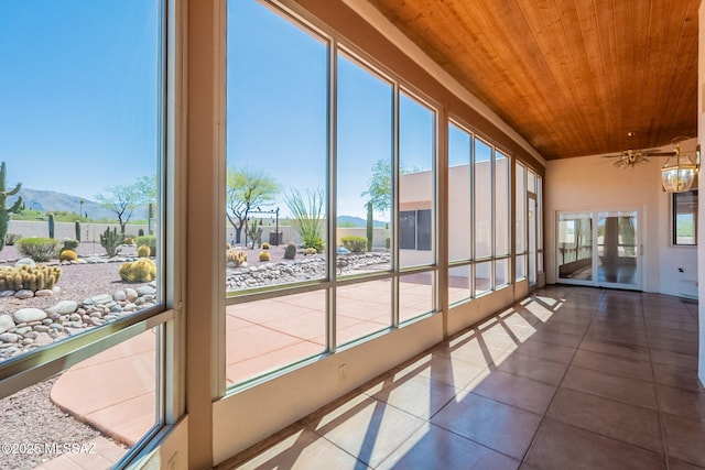 3655 N Harrison Rd, Tucson, AZ 85749 - unfurnished sunroom featuring wooden ceiling, tile patterned flooring, and a mountain view