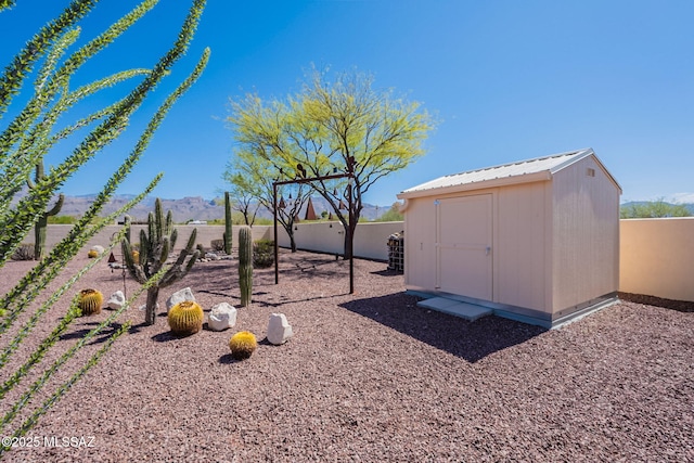 3655 N Harrison Rd, Tucson, AZ 85749 - fenced backyard with a mountain view and a storage shed