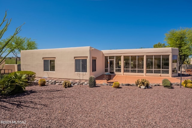 3655 N Harrison Rd, Tucson, AZ 85749 - back of property with a sunroom, stucco siding, and a patio