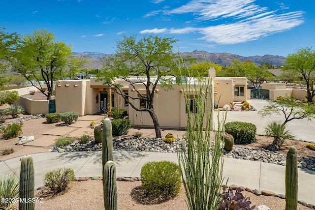 3655 N Harrison Rd, Tucson, AZ 85749 - pueblo-style home with a mountain view and stucco siding