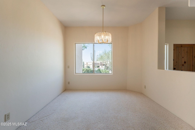 3655 N Harrison Rd, Tucson, AZ 85749 - empty room featuring a chandelier and carpet