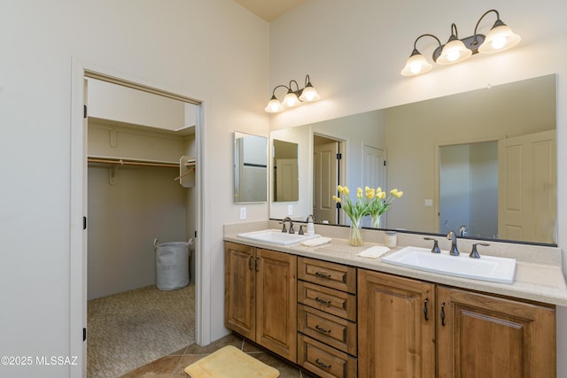 341 E Calderwood Rd, Tucson, AZ 85704 - bathroom with double vanity, tile patterned flooring, and a spacious closet