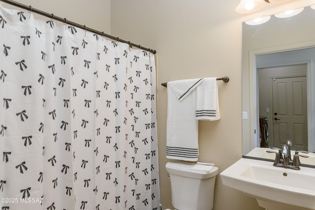 341 E Calderwood Rd, Tucson, AZ 85704 - full bath with a sink and a shower with shower curtain