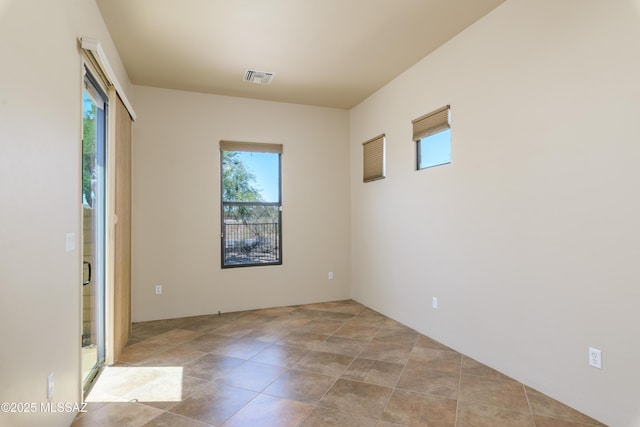 341 E Calderwood Rd, Tucson, AZ 85704 - spare room with plenty of natural light and tile patterned floors