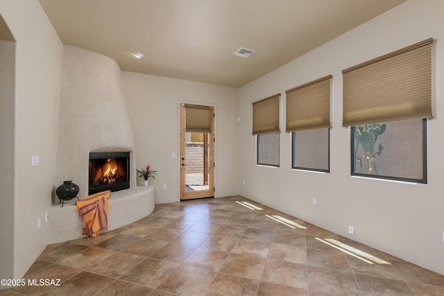 341 E Calderwood Rd, Tucson, AZ 85704 - unfurnished living room featuring a large fireplace
