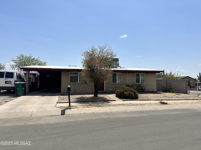 7420 N Stanton Pl, Tucson, AZ 85741 - ranch-style house with driveway, brick siding, and a carport