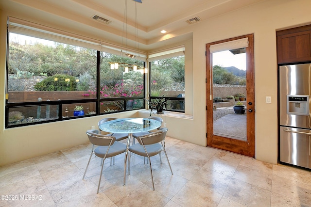 5254 W Saguaro Cliffs Dr, Tucson, AZ 85745 - dining area with plenty of natural light and stone tile flooring