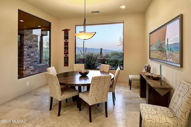 5254 W Saguaro Cliffs Dr, Tucson, AZ 85745 - dining space with healthy amount of natural light, recessed lighting, a mountain view, and light stone finish floors