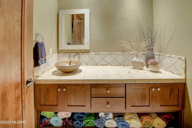 5254 W Saguaro Cliffs Dr, Tucson, AZ 85745 - bathroom featuring vanity and decorative backsplash