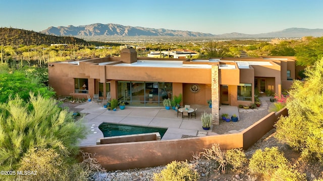 5254 W Saguaro Cliffs Dr, Tucson, AZ 85745 - back of property featuring a mountain view, stucco siding, and a patio