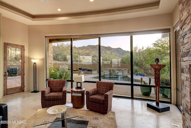 5254 W Saguaro Cliffs Dr, Tucson, AZ 85745 - living area featuring a raised ceiling, a mountain view, and recessed lighting