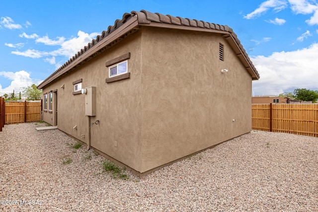 3710 S Bellingham Pl, Tucson, AZ 85730 - view of home's exterior with a fenced backyard and stucco siding