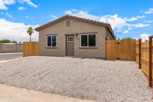 3710 S Bellingham Pl, Tucson, AZ 85730 - bungalow-style house featuring stucco siding and a gate