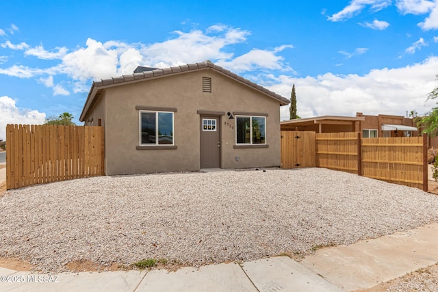 3710 S Bellingham Pl, Tucson, AZ 85730 - rear view of house featuring stucco siding and a gate