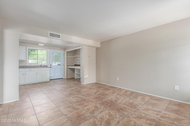 235 S Paseo Quinta Apt B, Green Valley, AZ 85614 - unfurnished living room with a sink and light tile patterned floors