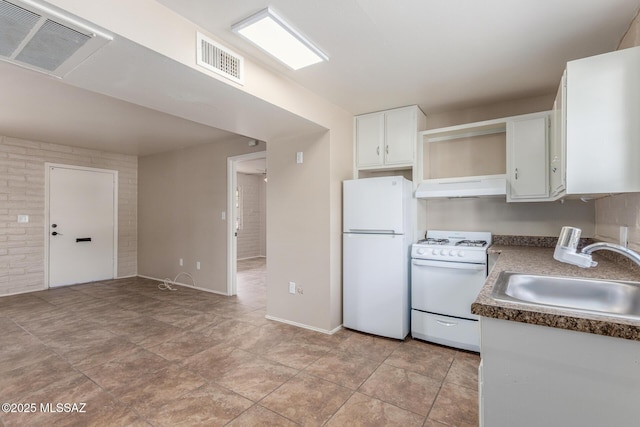 235 S Paseo Quinta Apt B, Green Valley, AZ 85614 - kitchen featuring white appliances, range hood, white cabinetry, and dark countertops