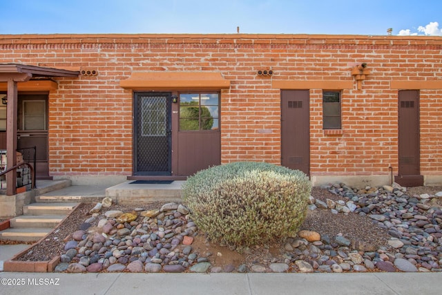 235 S Paseo Quinta Apt B, Green Valley, AZ 85614 - doorway to property with brick siding