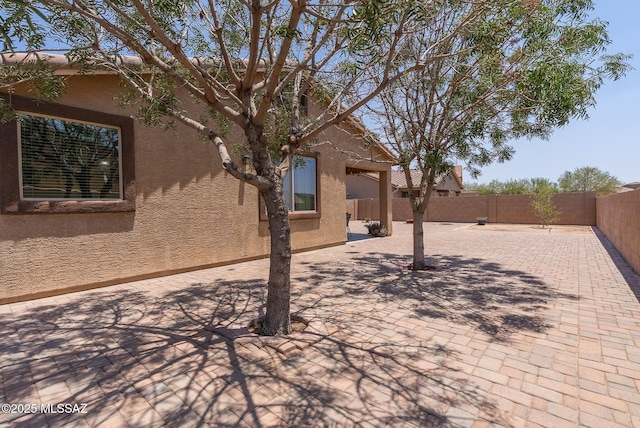 14199 N Bronze Statue Ave, Marana, AZ 85658 - fenced backyard with a patio
