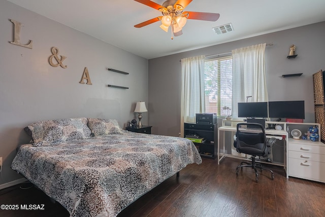 14199 N Bronze Statue Ave, Marana, AZ 85658 - bedroom with wood finished floors, a desk, and ceiling fan