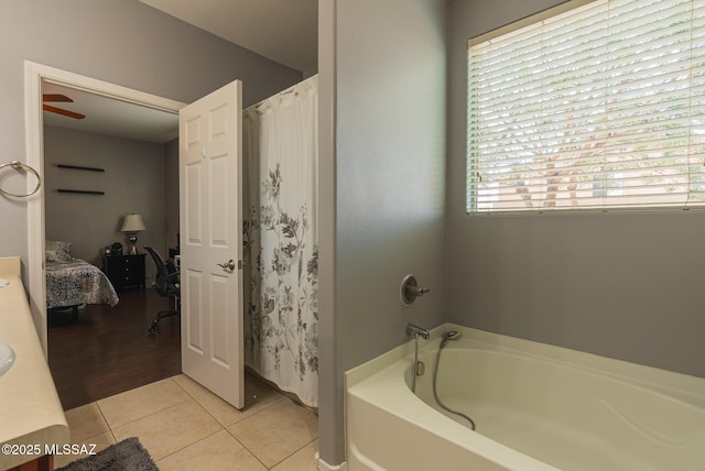 14199 N Bronze Statue Ave, Marana, AZ 85658 - bathroom featuring a garden tub, tile patterned floors, ensuite bathroom, vanity, and a shower with shower curtain