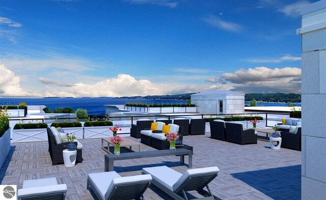 view of patio / terrace featuring a water and mountain view and an outdoor living space