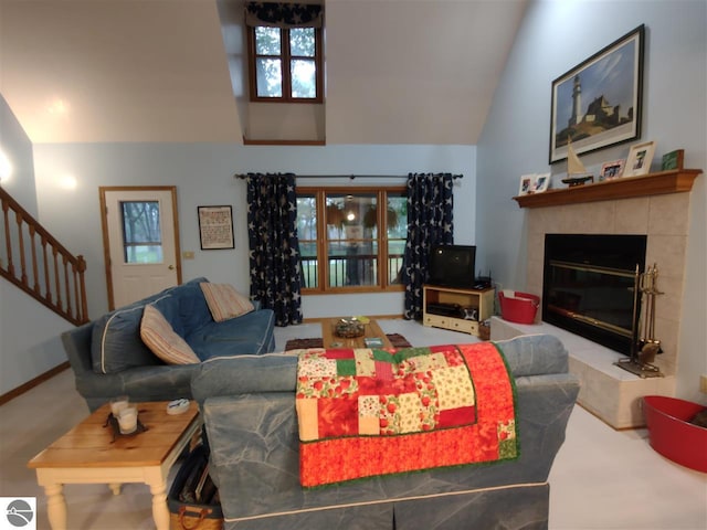 living room featuring a fireplace, carpet, and vaulted ceiling