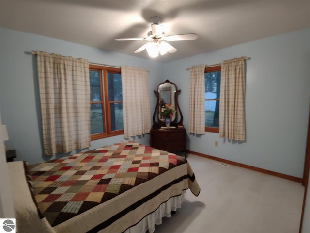 carpeted bedroom with ceiling fan