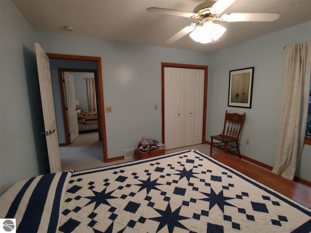 bedroom with ceiling fan and a closet