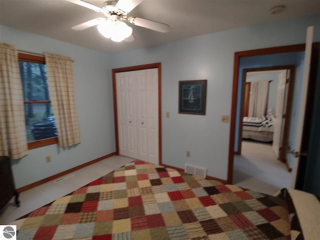 bedroom with ceiling fan and a closet