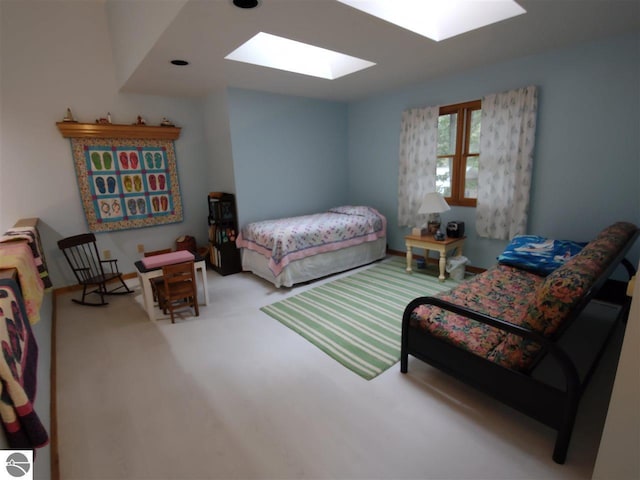 carpeted bedroom with a skylight