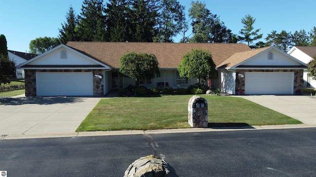 ranch-style house featuring a front yard and a garage