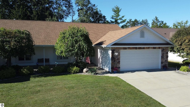 single story home with a front yard and a garage