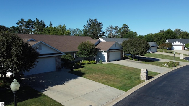 ranch-style home featuring a front yard and a garage