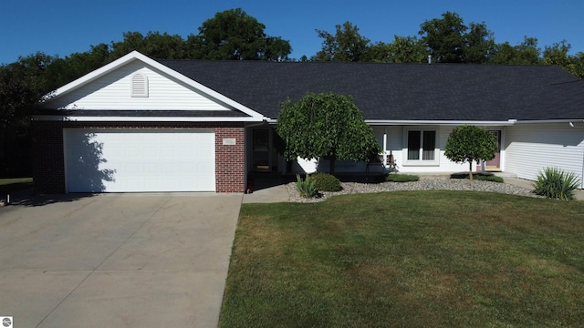 ranch-style house with a front lawn and a garage