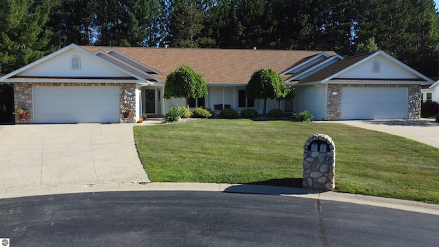 ranch-style home with a front yard and a garage